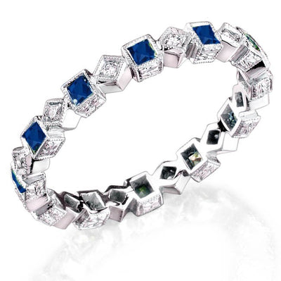 Mill-Grained, Bezel Set Princess Cut Blue Sappires and Micro Pave' Round Brilliant Cut Diamonds accented by hand engraved sides