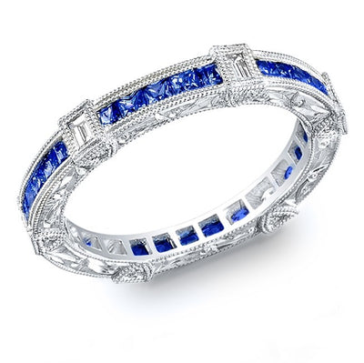 Art Nuevo: Exquisitely Hand Carved Masterpiece set with Custom Cut Princess Sapphires and Baguette Cut Diamonds.